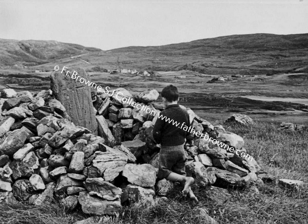 CHILD PRAYING AT GRAVE